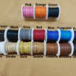 Colorful spools of thread on display.