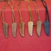 Leather knife sheaths on red background.