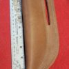 Leather sheath next to a measuring ruler.