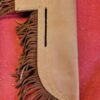 Leather axe sheath with fringe detail.