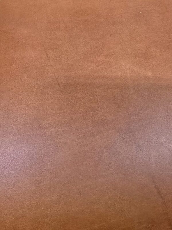 20241227_122355 Brown leather texture with subtle marks.