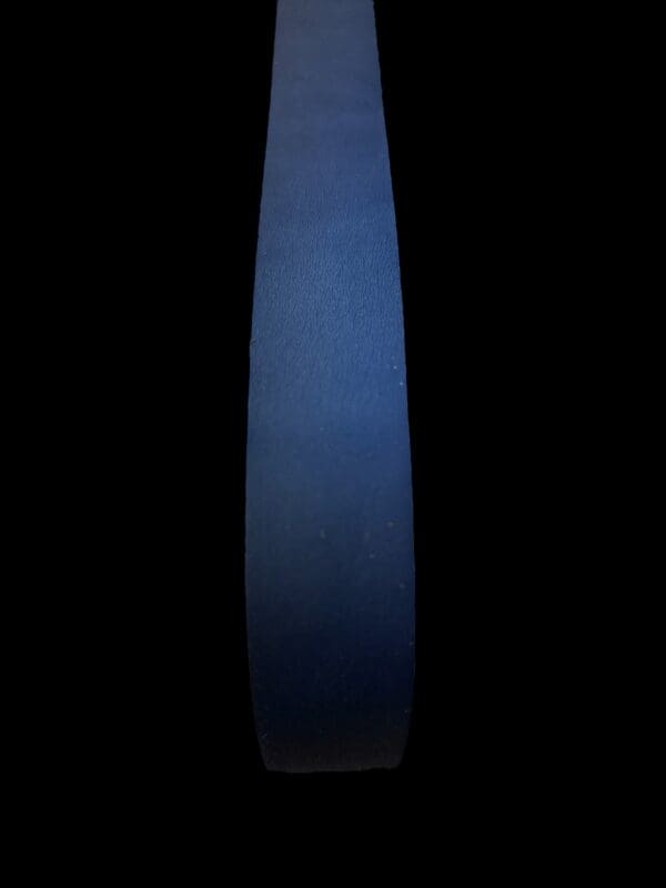 Here's an alt tag for the image: Dark blue leather strip.