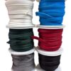 Spools of colorful ribbon arranged in stacks.