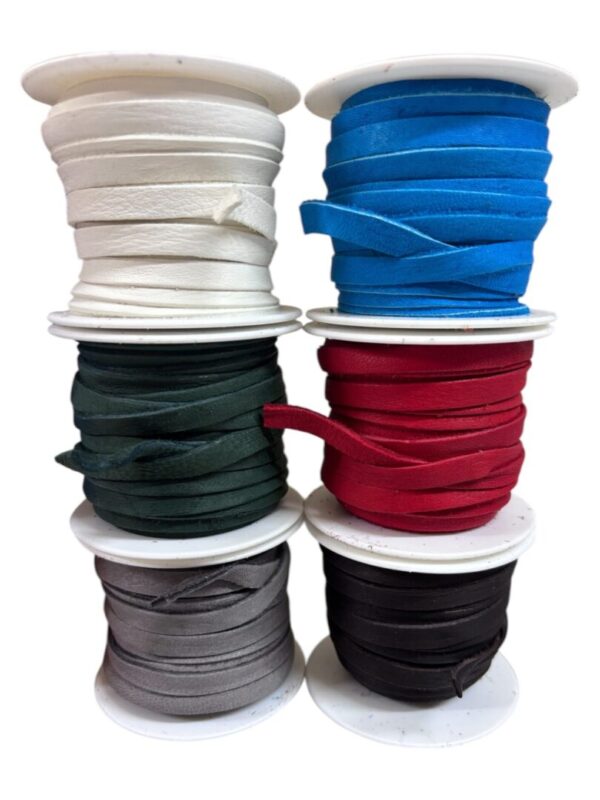 Spools of colorful ribbon arranged in stacks.