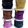 Colorful spools of ribbon stacked in rows.