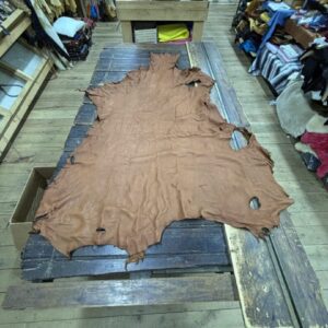 IMG_2894 Large brown leather hide on table.