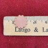 Leather flower shape on measuring ruler.