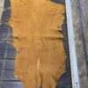 IMG_4863 Brown leather hide on wooden table.