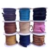 Assorted colorful rolls of ribbon spools.