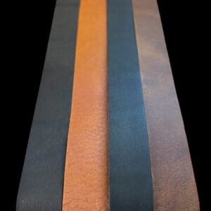 Four leather strips in black, brown, and orange.