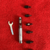 Tools and nozzles on red background.