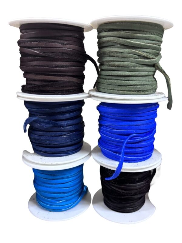 Spools of colored ribbon in various shades.