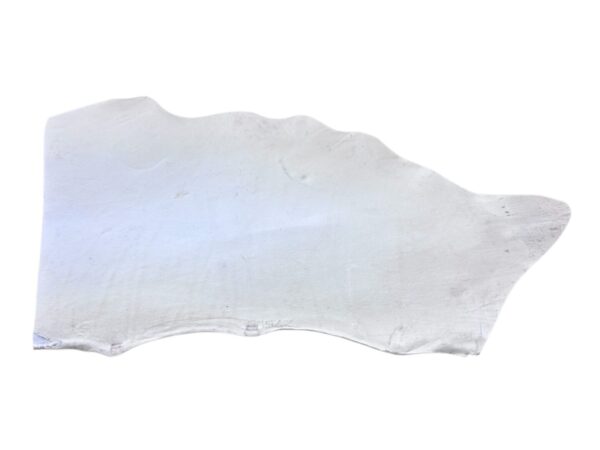 ONFZ2243 White, irregularly shaped flat object on display.