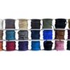 Colorful spools of various laces arranged neatly.