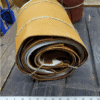 Rolled tan leather hides for sale.