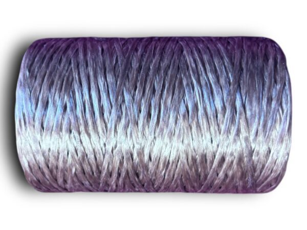 Purple and white gradient yarn spool.