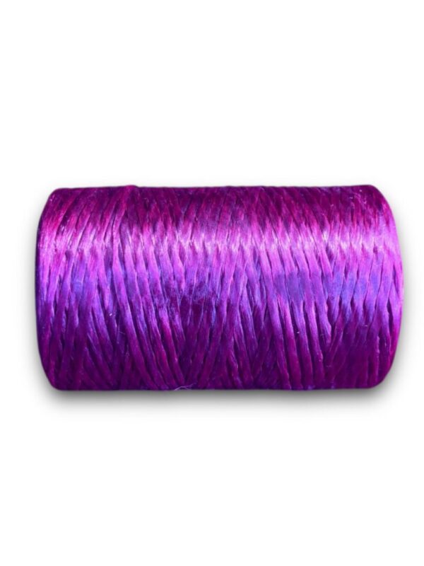 Purple twine spool on white background.