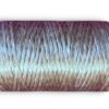 Gradient-colored spool of yarn, close-up.