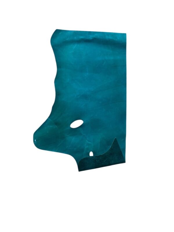 WIGX2581 Teal leather hide with cut-out shapes.