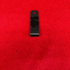 Black metal clip on red background.