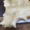 Animal hide on a wooden table.