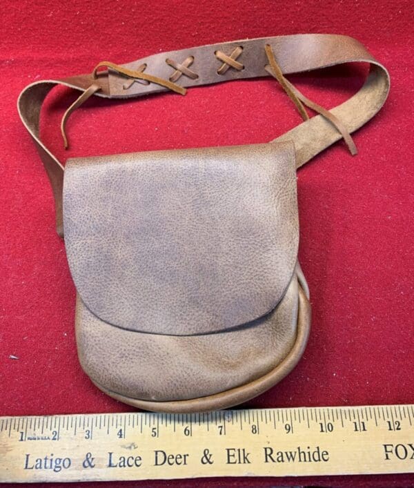 A close view of a leather shooting bag up for sale