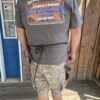 IMG_9371 Man in apron and gray t-shirt outdoors.