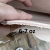 Hand measuring leather thickness, marked 6-7 oz.