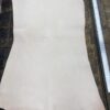 Large piece of light-colored leather material.