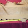Tan leather hide with a measuring tape.