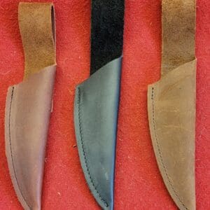 One black and two brown knife sheaths