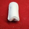 White fabric cylinder on red surface.