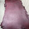 20240215_180103 - Copy Maroon leather hide on a flat surface.