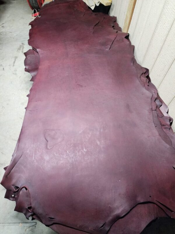20240215_180103 - Copy Maroon leather hide on a flat surface.