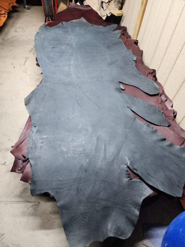 20240215_180932 Large piece of leather on a table.