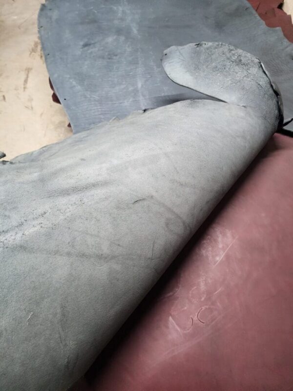 20240215_180942 Rolled sheets of leather in different colors.