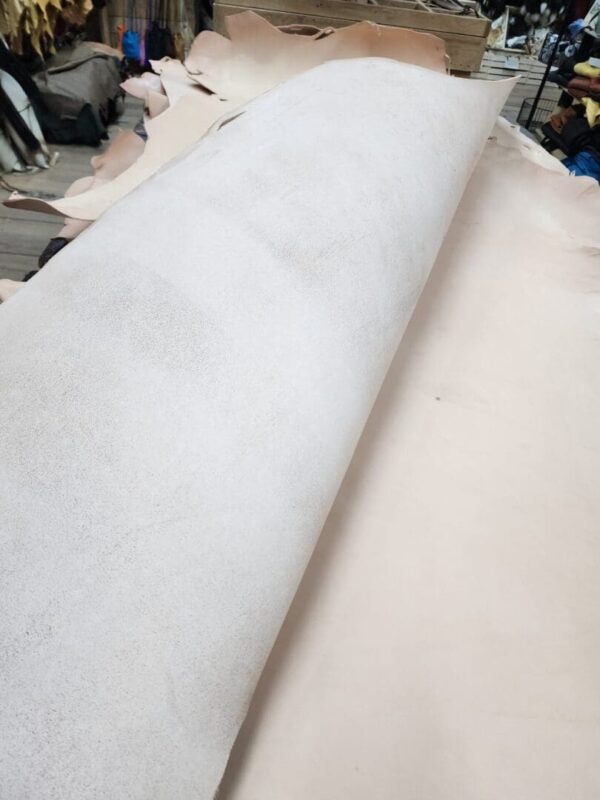 Roll of leather on a work table.