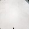 Large piece of pale leather on table.