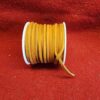 Roll of orange suede leather cord.
