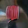 Roll of red and white insulated wire.