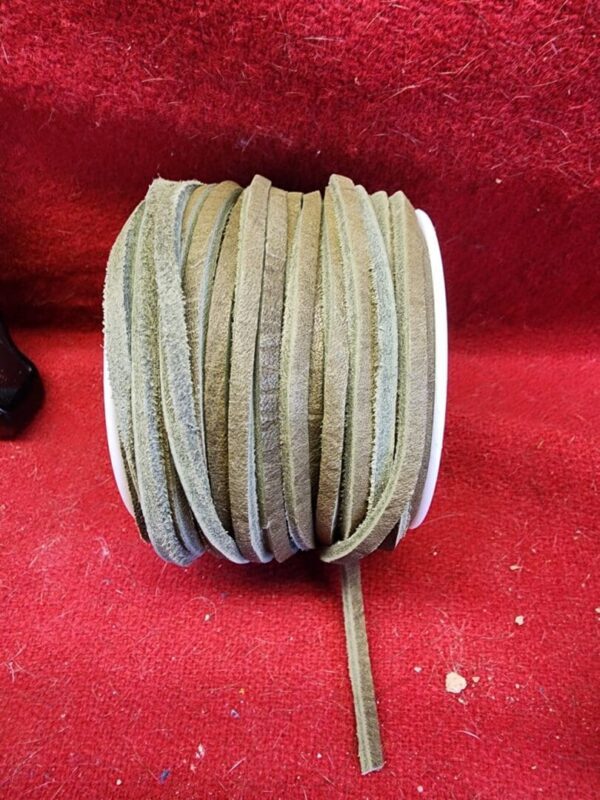 Roll of beige suede leather strips.