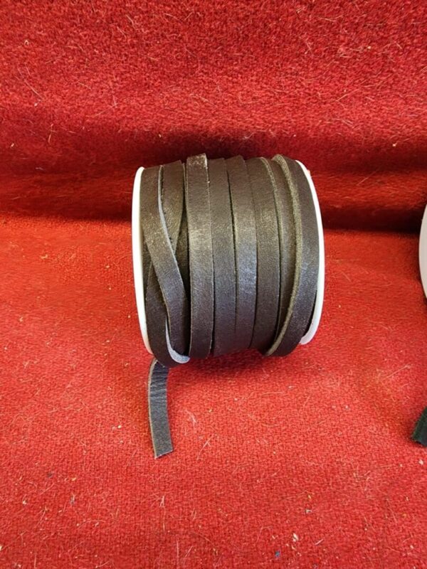 Roll of dark brown leather cord.
