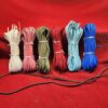Six colorful bundles of cords on display.