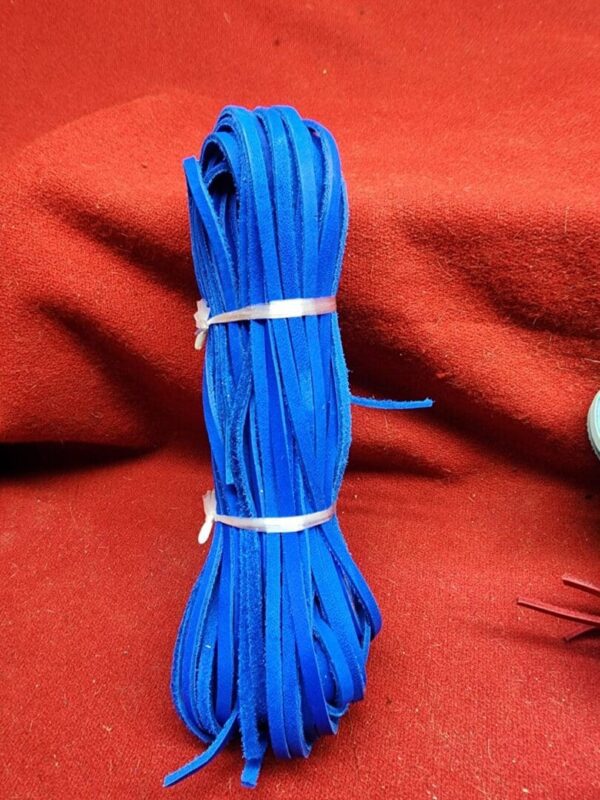 Blue shoelaces on a red background.