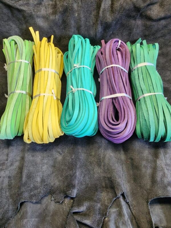 Colorful leather strips on dark fabric.