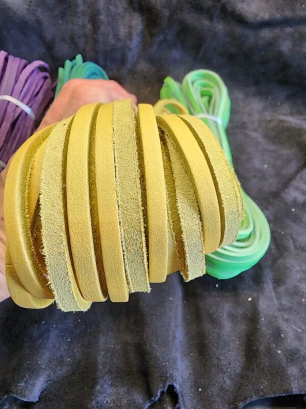 Yellow foam strips held in hand.