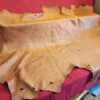 Large piece of tan leather on display.