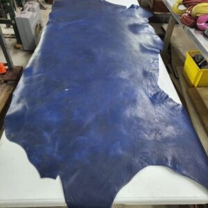 20240620_103730 Large blue leather piece on a work table.