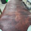 Large piece of dark brown leather.