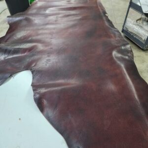 20240620_124343 Brown leather hide laid out on surface.